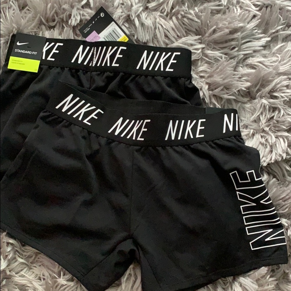 kids black nike shorts with tags